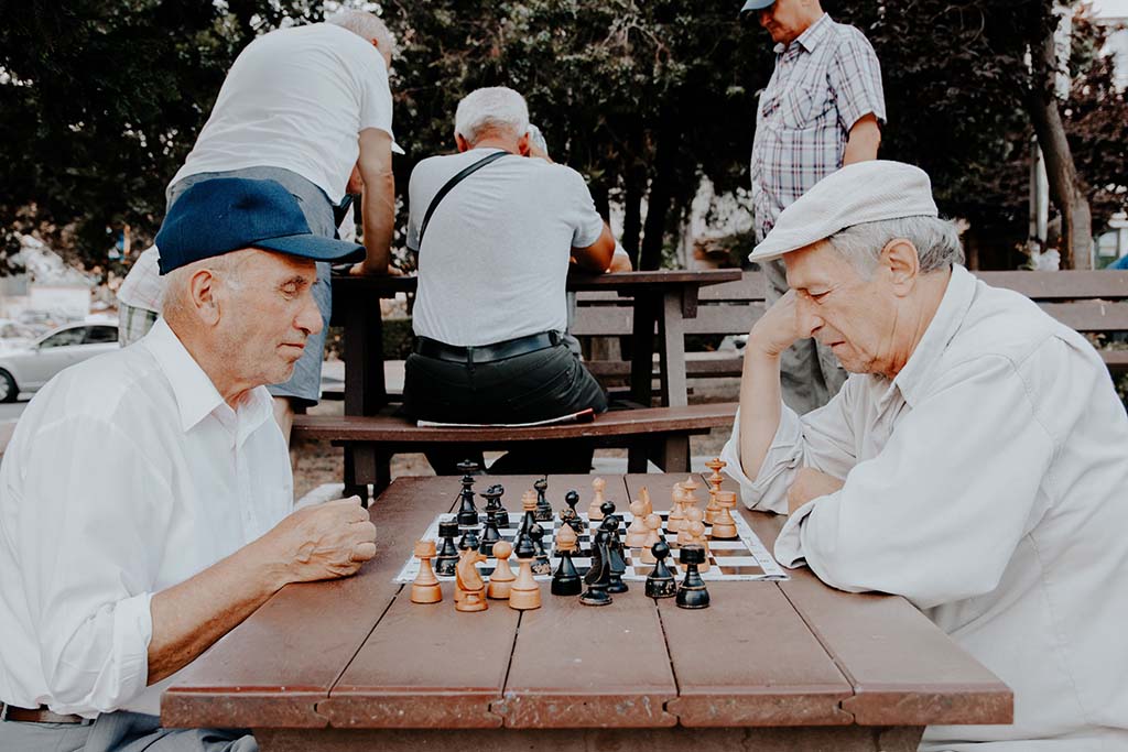 older men playing chess