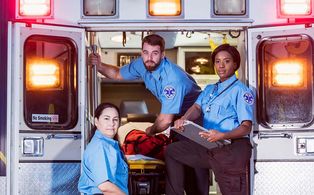 three emts in ambulance