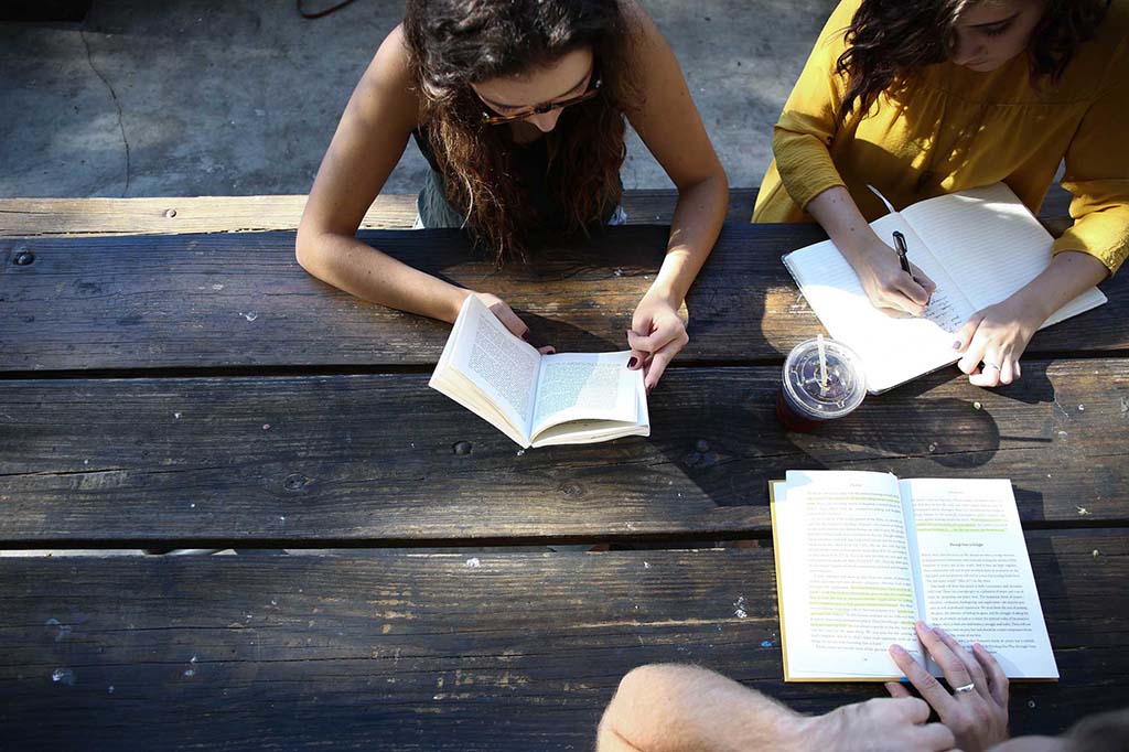 students studying on wood table