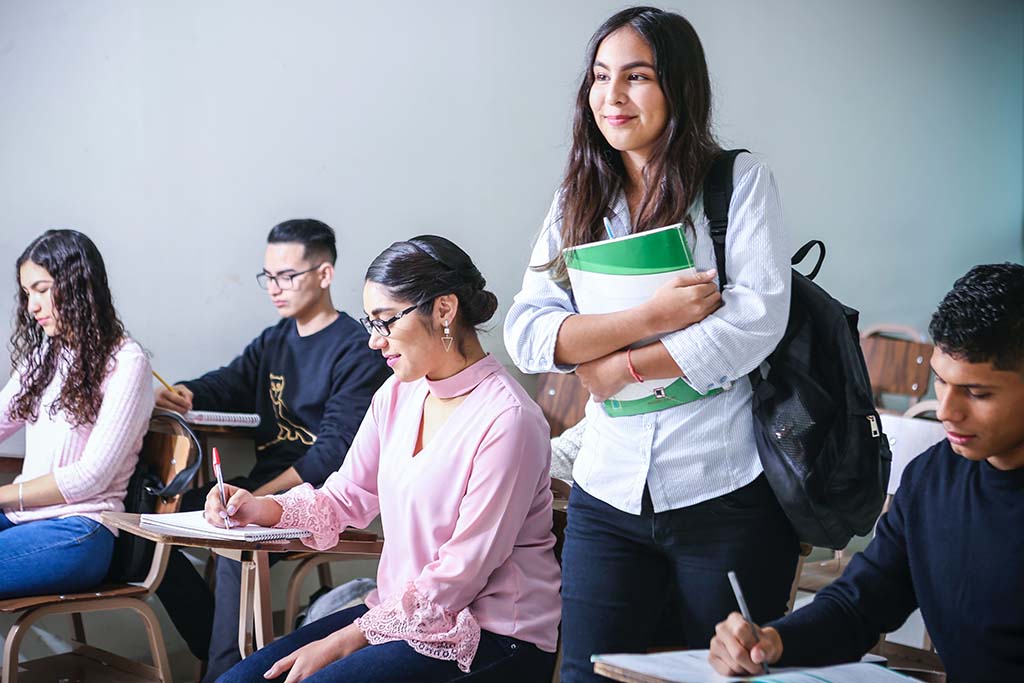 young woman arriving to class