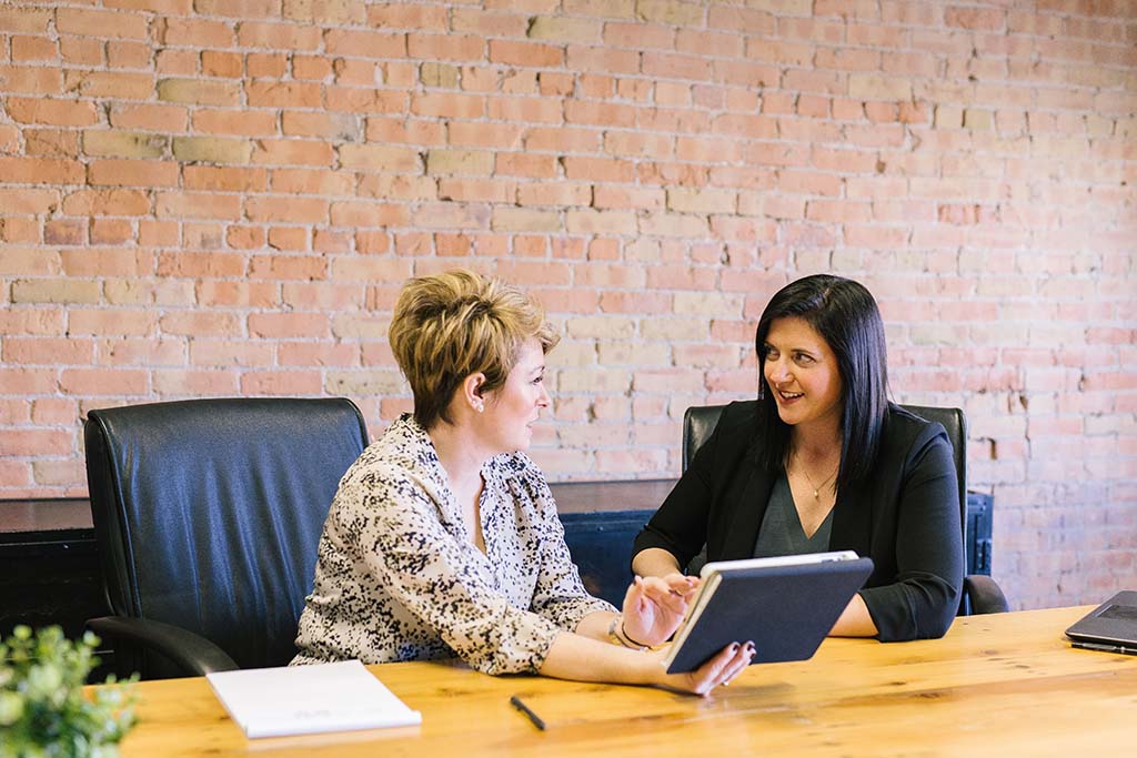 two women in a meeting