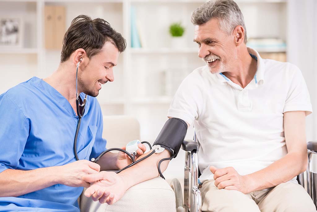 medical assistant taking blood pressure