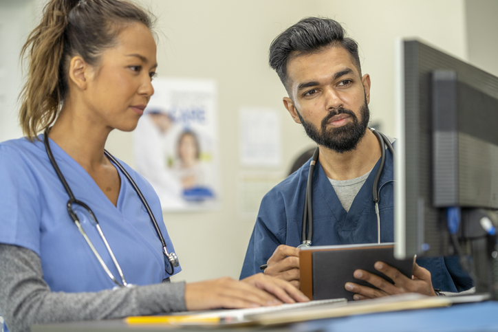 two nurses looking at monitor