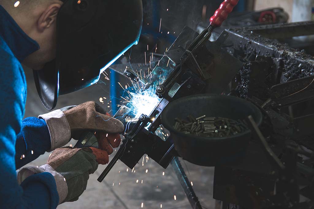 man working with sparks flying