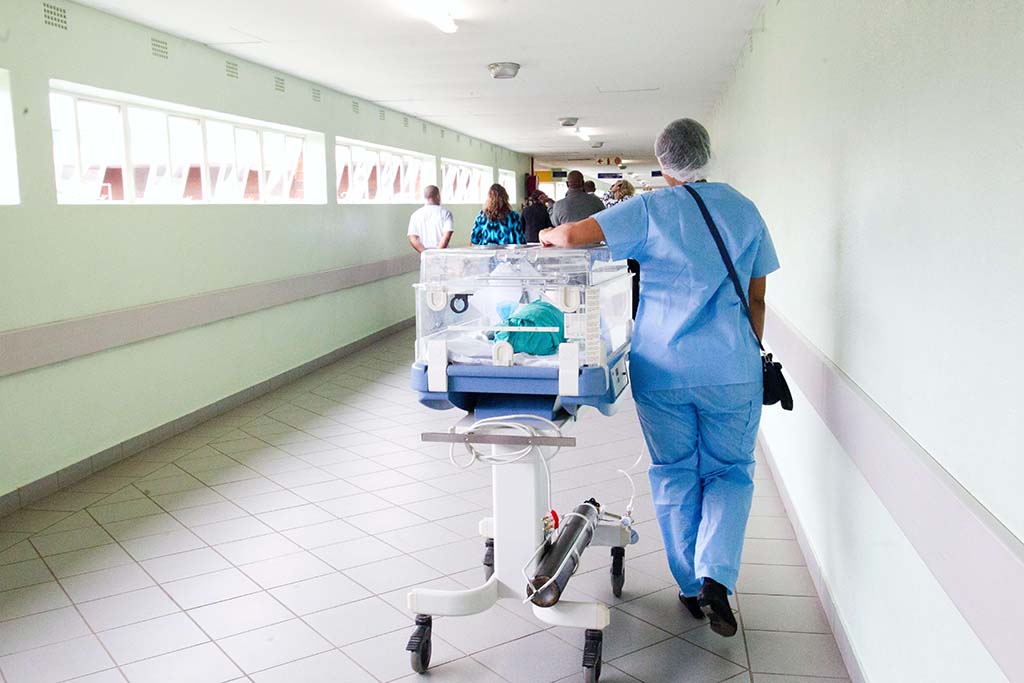 nurse walking down hallway