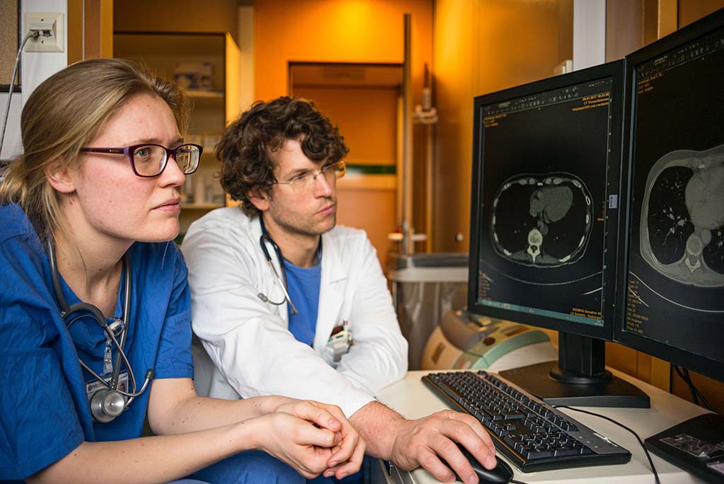 two techs looking at x-rays