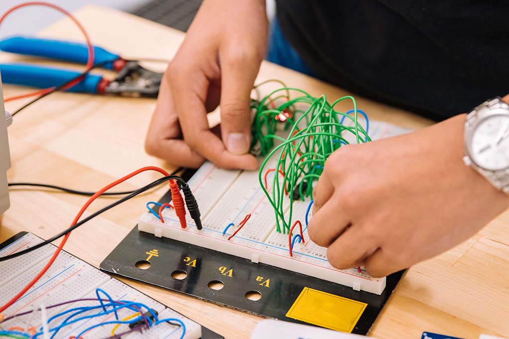 student troubleshooting wire connections