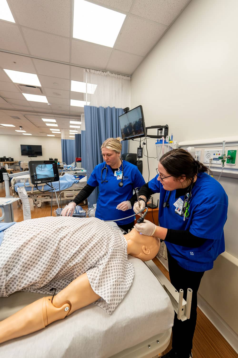 Student Listening to Patients lungs